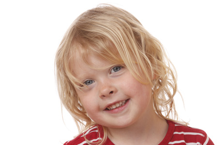 Portrait of a smiling young girl on white backgroundの写真素材