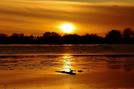 A beautiful sunset on the lakeの写真素材