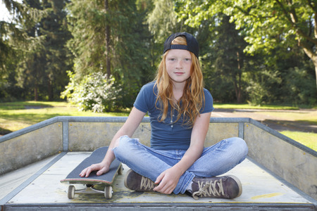 Cool young girl outdoor with skateboardの写真素材