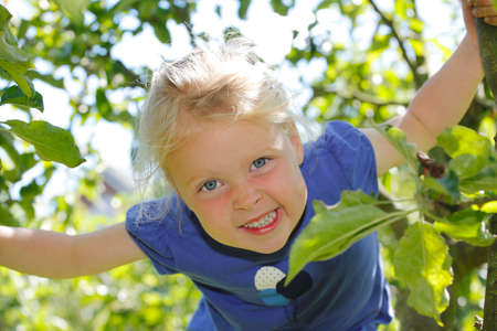 Portrait of a happy young girl outdoorsの写真素材
