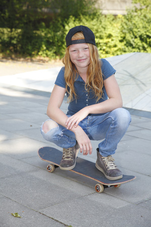 Cool young girl outdoor with skateboardの写真素材