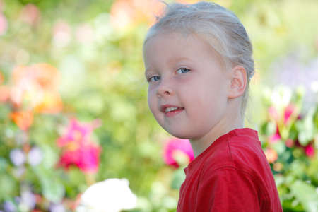 Portrait of a happy young girl outdoorsの写真素材