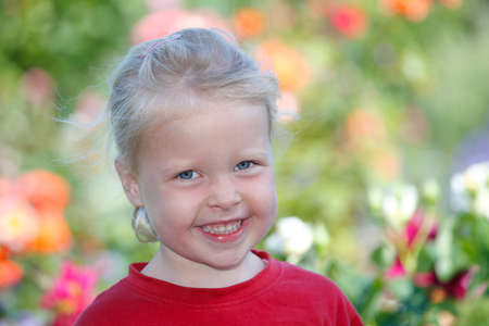 Portrait of a happy young girl outdoorsの写真素材