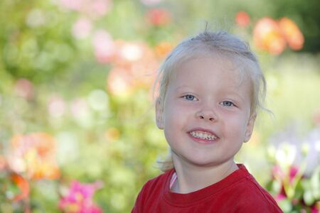 Portrait of a happy young girl outdoorsの写真素材