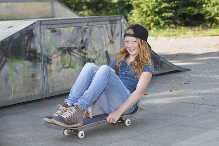 Cool young girl outdoor with skateboardの写真素材