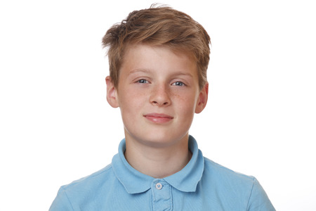 Portrait of a confident teenage boy on white backgroundの写真素材