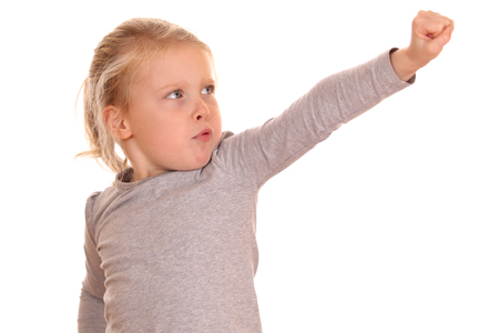 Portrait of a strong young girl on white backgroundの写真素材