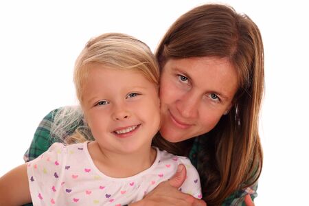 Portrait of a mother and daughter on white backgroundの写真素材