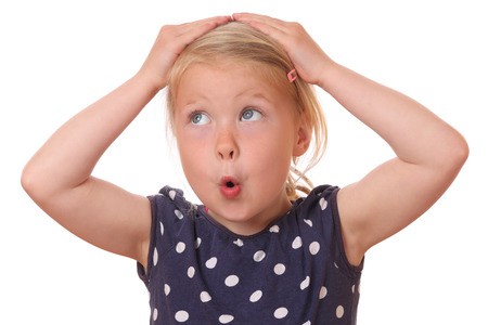 Portrait of a surprised young girl on white backgroundの写真素材