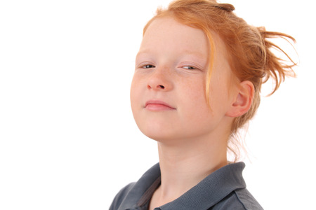 Portrait of an arrogant young teen girl on white backgroundの写真素材