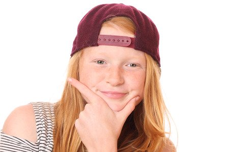 Portrait of a smiling young girl on white backgroundの写真素材