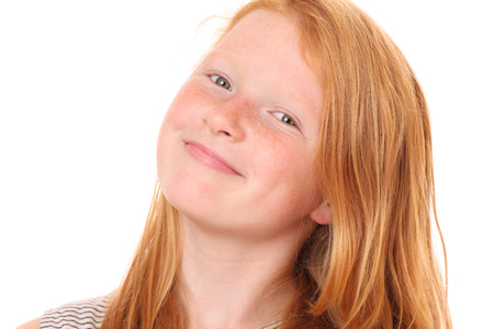 Portrait of a smiling young girl on white backgroundの写真素材