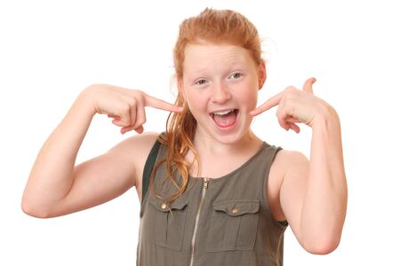 Portrait of a surprised teenage girl on white backgroundの写真素材