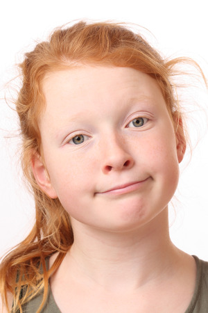 Portrait of a sad teenage girl on white backgroundの写真素材