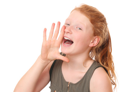 Portrait of a shouting teengae girl on white backgroundの写真素材