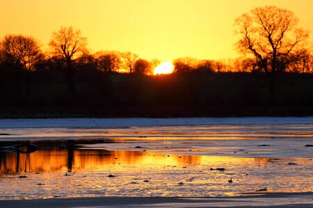 A beautiful sunset on the lakeの写真素材