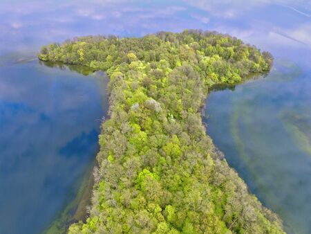 Aerial view of an island in a lake in northern europeの写真素材