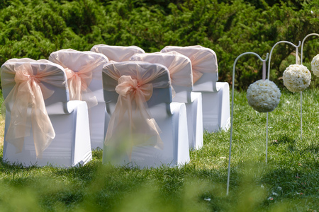 wedding ceremony decorated chairs outdoors on fgreen fieldの写真素材