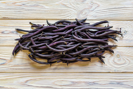 heap of france violet beans in retail vegetable super market for sale.の写真素材
