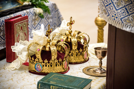 Wedding in Orthodox church in Ukraine, Chernihiv city. Two wedding crowns in the church.