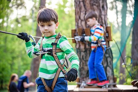 Twin bothers climbing in adventure park is a place which can contain a wide variety of elements,...
