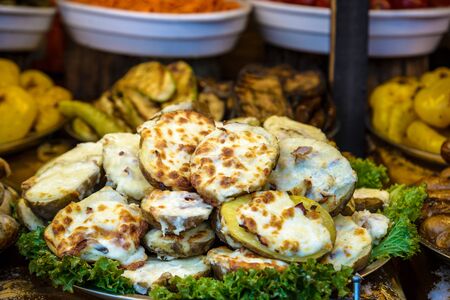 Stuffed potato with bacon, cheese and green onion.の写真素材