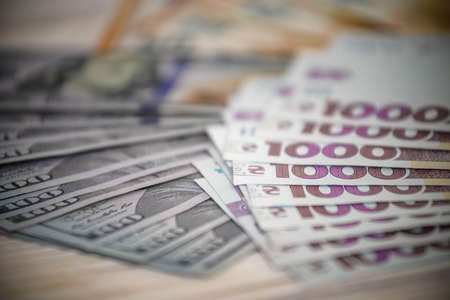 Dollar banknotes of the USA. Amerikan dollars. Money of USA and Ukrainian hryvnia. 1000 Ukrainian...
