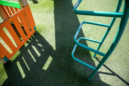 Colorful playground made of plastic empty outdoor playground set playground equipment. play area. Play area. Garden equipment. Children's slide. School yard. Playground in the park.の写真素材