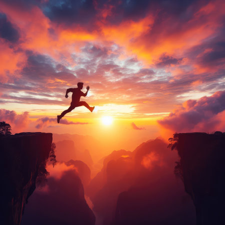 Man jump through the gap between hill. man jumping over cliff.の素材
