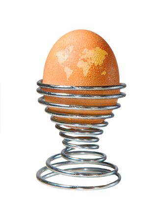 An egg in an eggcup with beads of condensation and markings on the shell depicting a map of the world. Developed as a concept piece to adress global warming and its effect on animal welfare. の写真素材