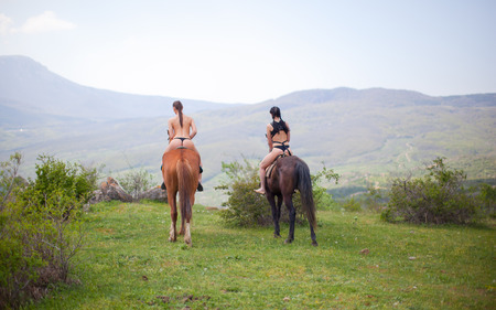 Two nude women on the horsesの写真素材