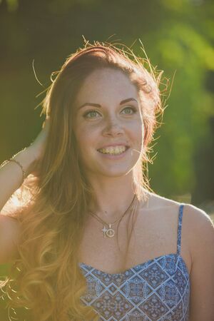 Beautiful girl in summer sun