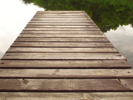 wooden pier over a riverの写真素材