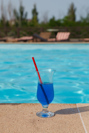 blue cocktail near poolの写真素材