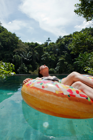 girl in the pool at inflatable ringの写真素材