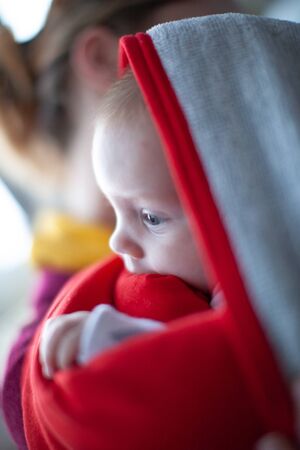 Baby in red towel portraitの写真素材