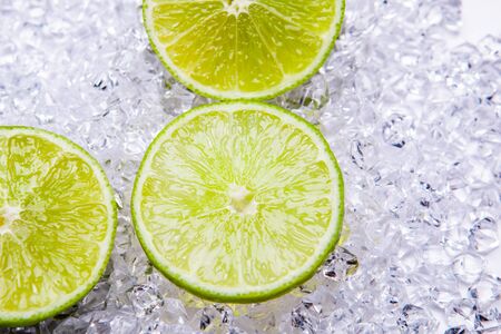 fresh lime slices on the iceの写真素材