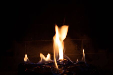 fire in fireplace figuresの写真素材