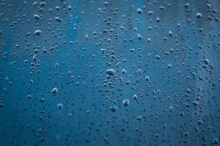 Water participles. Water particales running off a car bonnet on a cold winters day.の写真素材