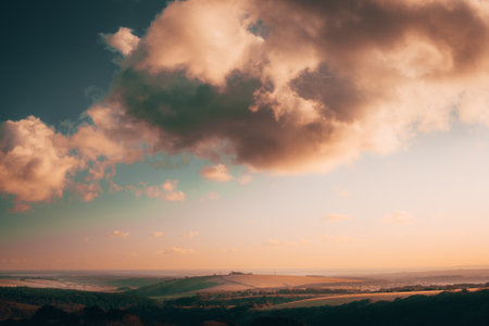 Dramatic colouful clouds during a sunset overcasting on the South coast countryside hills in Hampshireの写真素材