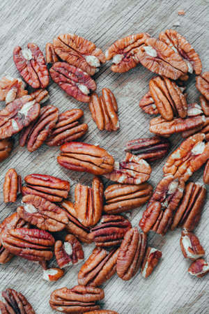 Pecan nuts on a wooden table