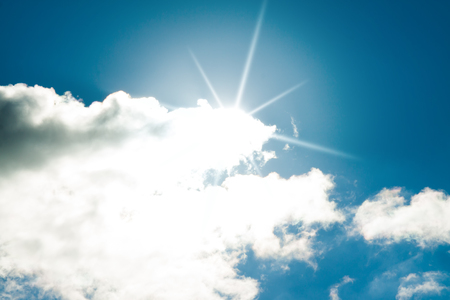 Blue sky with sun and cloud. Nature background. の写真素材