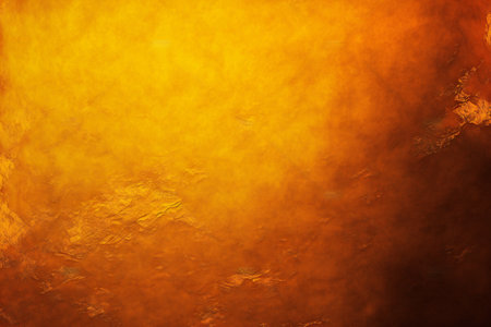 Bright warm orange and yellow gold colors in fiery, abstract, backgroundsの素材