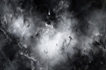 Black smoke on a black background. Abstract background. Design element.の素材