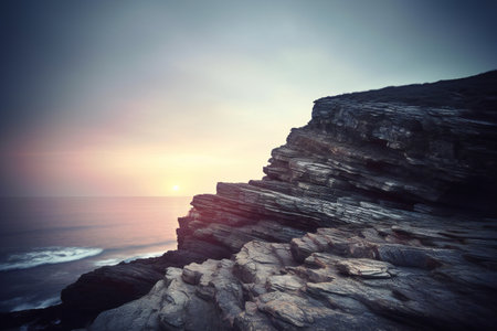 Sunset over the sea with rocks and sky. Toned.の素材