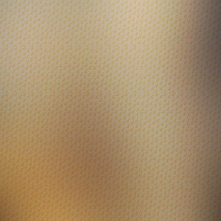 abstract golden background with some smooth lines in it and some spots on itの写真素材