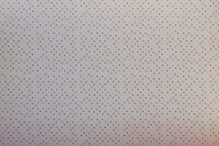 White and red polka dot fabric texture background. Close up.の写真素材
