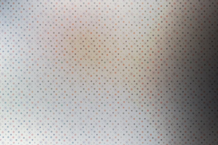 abstract background with colored dots on a white sheet of paper.の写真素材