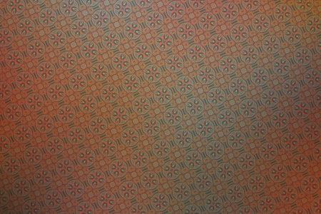 Textile cloth brown and red with a pattern of rhombuses
