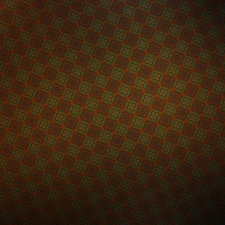 Textile cloth black and orange with a kaleidoscope pattern in it